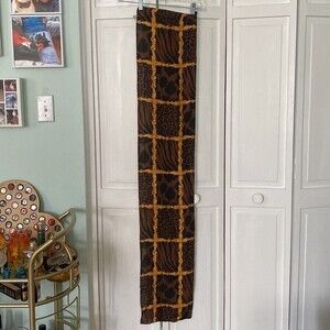 100% silk scarf.  All the animal prints with gold embellishment